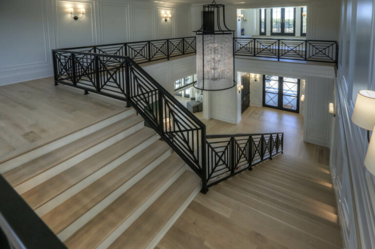 wide stairs design with intricate railing full view