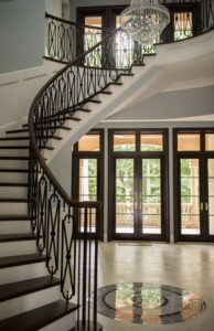 Slim Modern Wrought Iron Balusters with a Warm Wood Rail